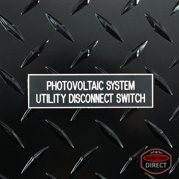 White on Black Panel Tag - "Photovoltaic System Utility Disconnect Switch" (2 Lines)